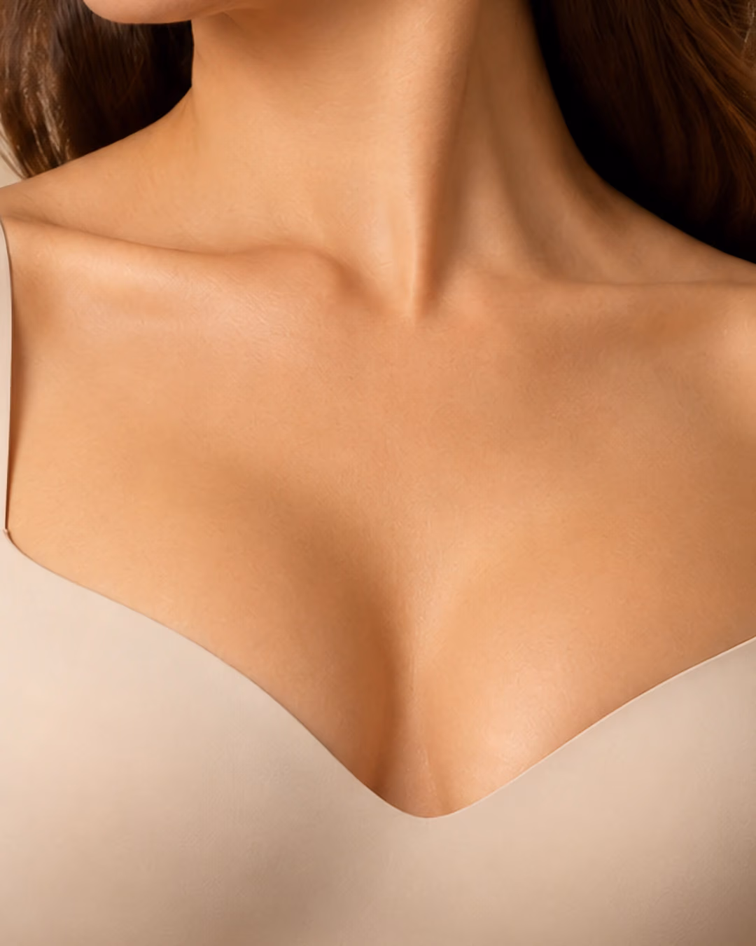 Close-up of a woman’s neckline and collarbones